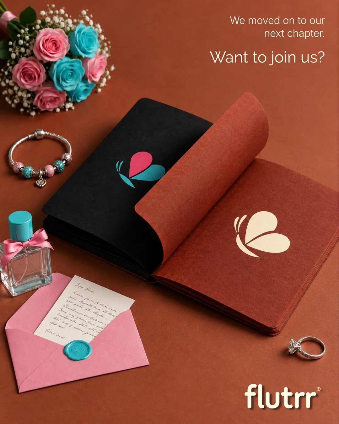 flutrr, the love marriage app: an open book with the flutrr butterfly, beside roses, a letter and a ring